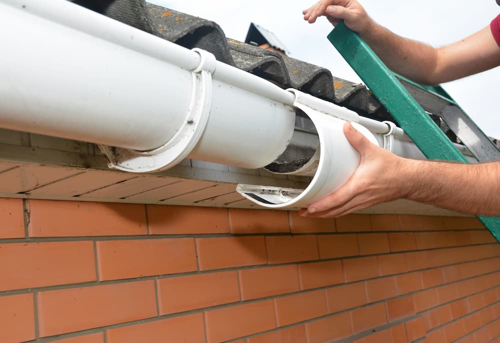 Repairing a damaged gutter joint on a residential home