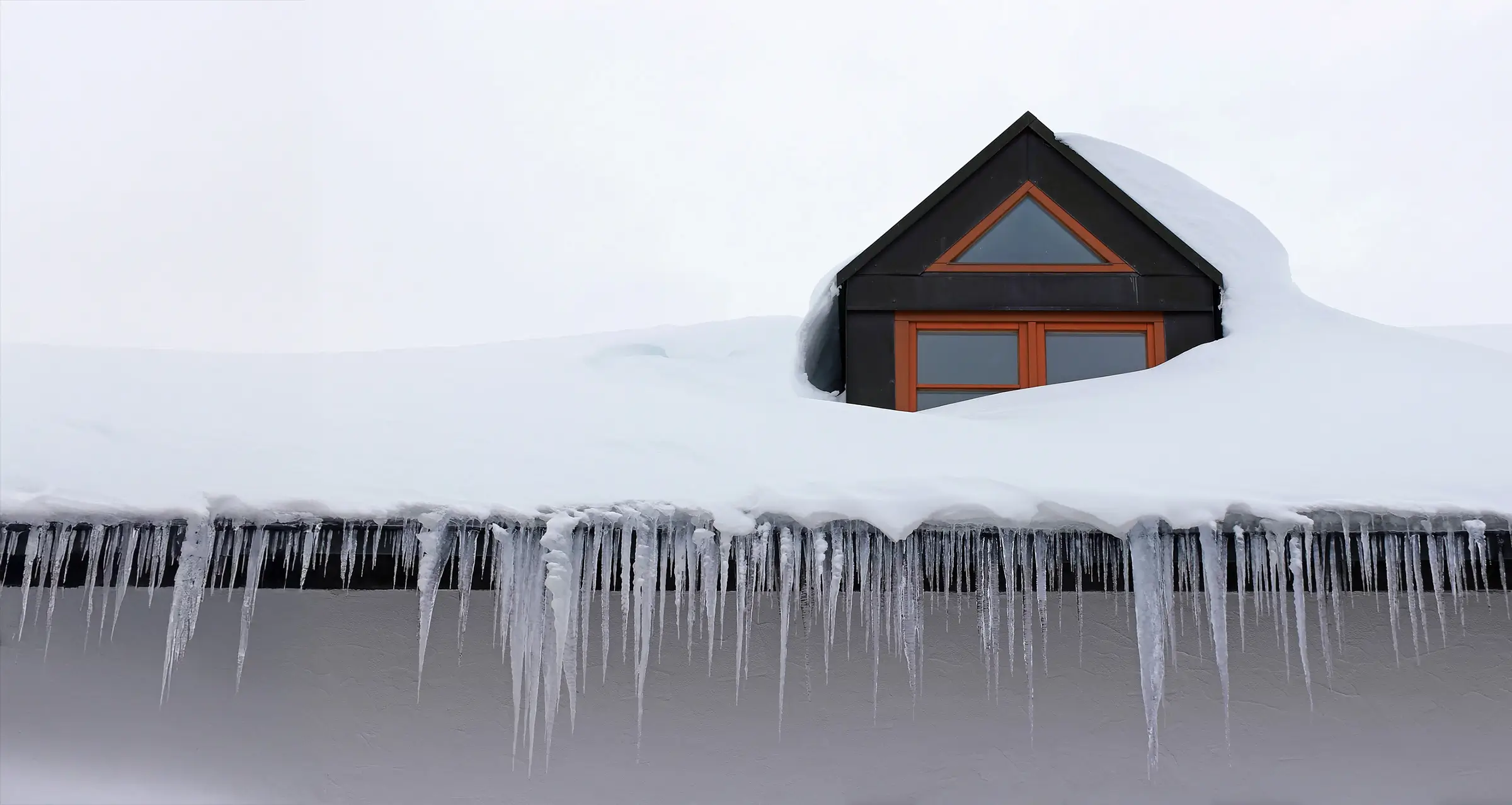 Featured image for “What Are the Dangers of Gutter Icicles and How to Prevent Them”