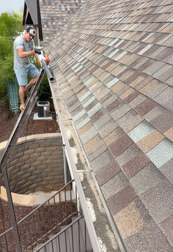 cleaning gutters with leaf blower
