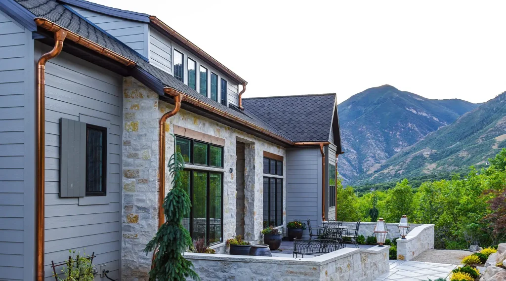 downspouts and half round copper gutters side view